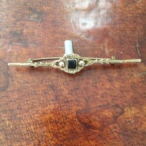 Vintage brass pin with black stone